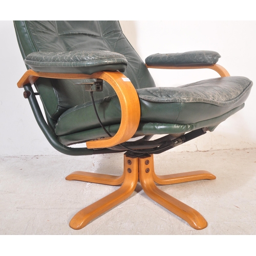 1178 - Retro 20th century green leather and bentwood swivel armchair. Raised on splayed leg base with bentw... 