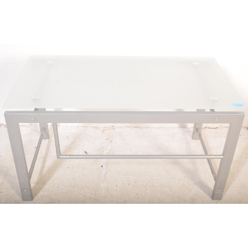 1181 - A retro vintage 20th Century metal and glass coffee / occasional table. Of rectangular form with tra... 