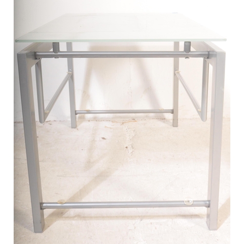 1181 - A retro vintage 20th Century metal and glass coffee / occasional table. Of rectangular form with tra... 