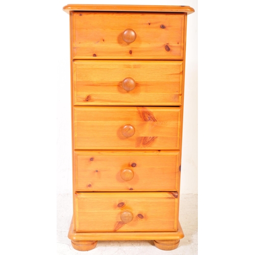 1187A - A 20th Century pine pedestal chest of drawers. The drawers having a bank of five drawers each with t... 