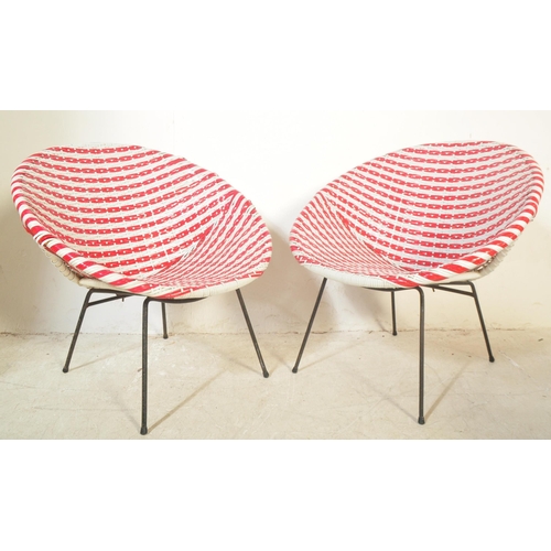 1193 - A pair of retro vintage 20th Century wicker cane satellite chairs in the manner of Franco Albini. Th... 