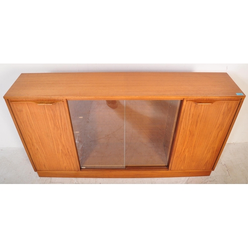 1196 - A retro 20th Century Scandinavian teak bookcase / display cabinet having two central sliding glass d... 