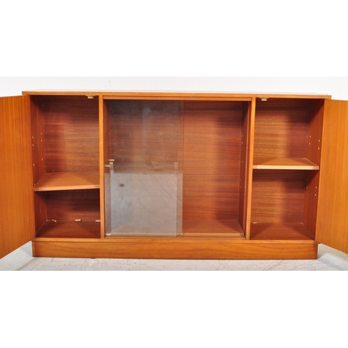 1196 - A retro 20th Century Scandinavian teak bookcase / display cabinet having two central sliding glass d... 