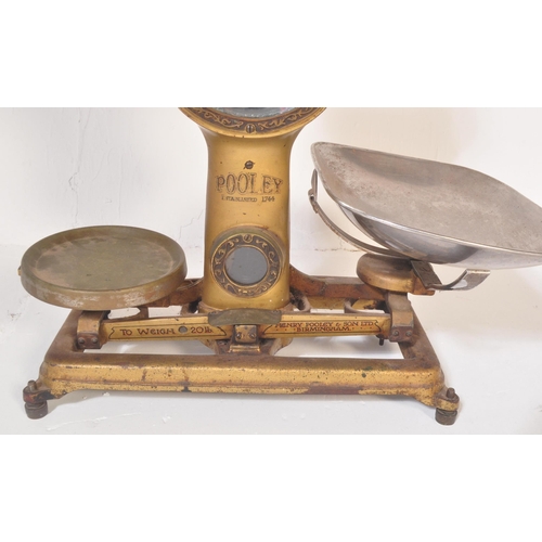 1201 - Pooley & Sons - A large set of mid 20th Century shop scales finished in gold tones with makers marks... 