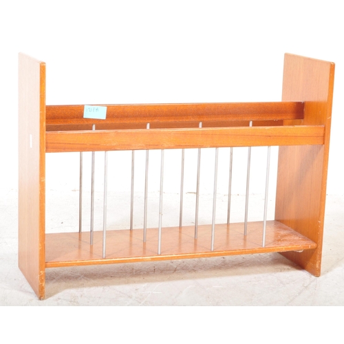 1217A - A vintage mid 20th Century1970's  teak wood magazine rack. The rack having three sections with wire ... 