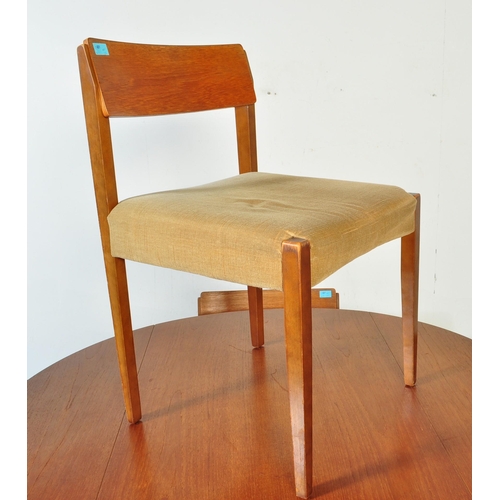 1240a - A retro vintage mid 20th Century teak drop leaf table with four chairs. The table of circular form w... 