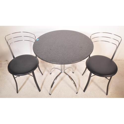 1251 - A contemporary cafe style table and chairs. The table having a circular black polished granite surfa... 