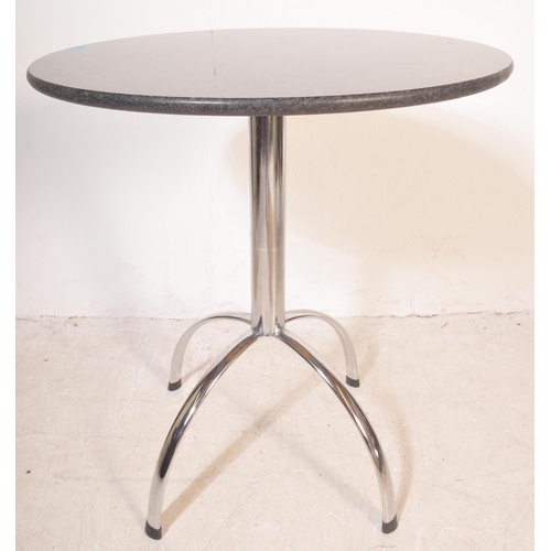 1251 - A contemporary cafe style table and chairs. The table having a circular black polished granite surfa... 