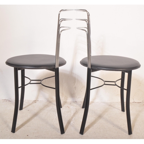 1251 - A contemporary cafe style table and chairs. The table having a circular black polished granite surfa... 