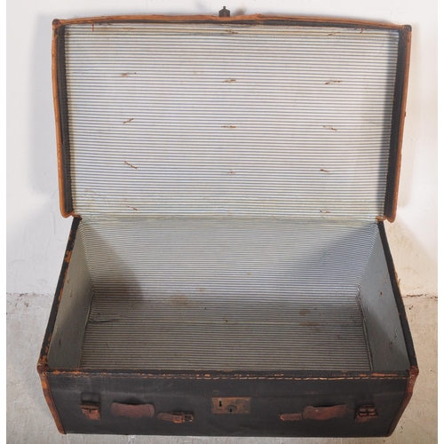 1256 - An early 20th century black leather steamer type travel trunk with white stencilled initials to lid ... 