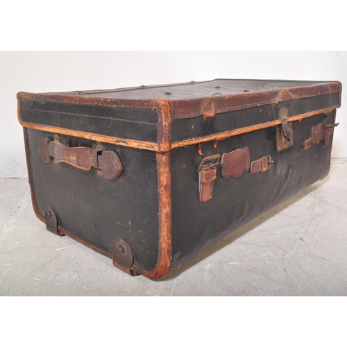 1256 - An early 20th century black leather steamer type travel trunk with white stencilled initials to lid ... 