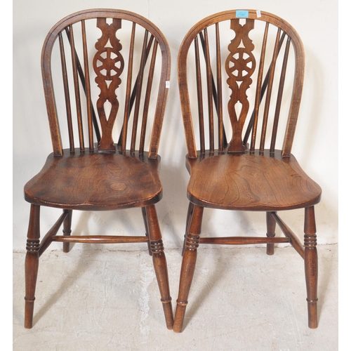 1261 - A set of four retro vintage 20th century dark beech and elm wood Ercol Fleur-de-Lys back pattern din... 