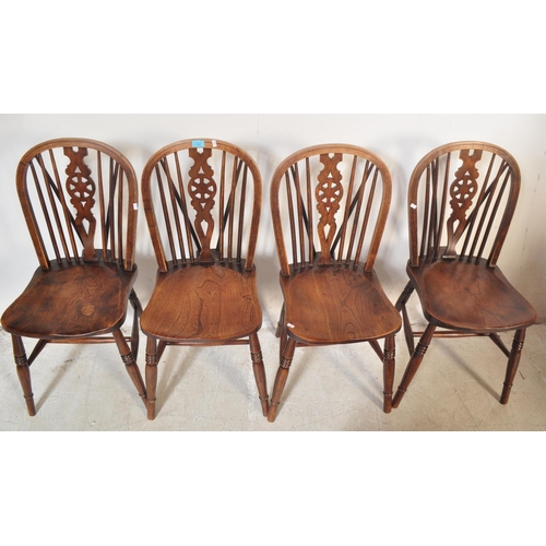 1261 - A set of four retro vintage 20th century dark beech and elm wood Ercol Fleur-de-Lys back pattern din... 