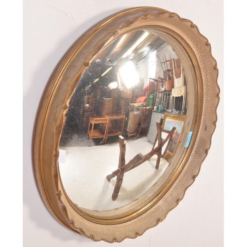 1262 - A vintage 20th century circa. 1940's wall fish eye - convex  mirror of circular form having pie crus... 