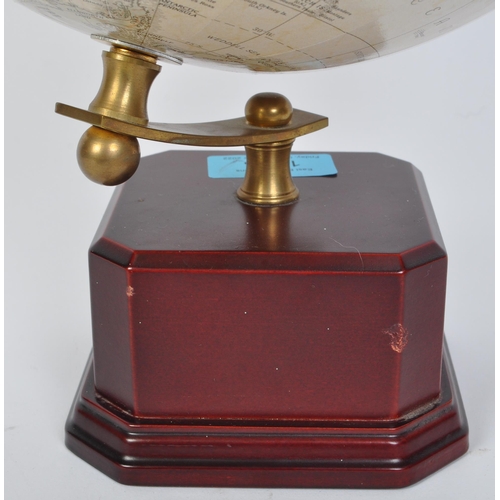 1263 - A vintage retro 20th century World Classic Series desk top globe held upon brass frame on wooden eff... 