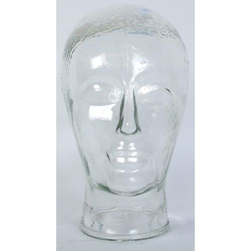 1264 - A vintage 20th century clear glass milliners mannequin pressed glass head having moulded features an... 