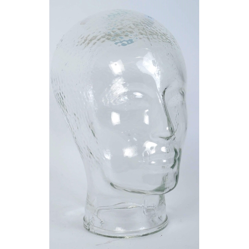 1264 - A vintage 20th century clear glass milliners mannequin pressed glass head having moulded features an... 