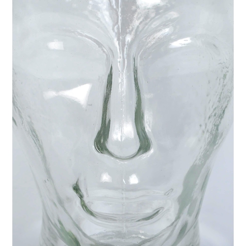 1264 - A vintage 20th century clear glass milliners mannequin pressed glass head having moulded features an... 