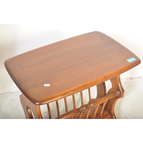 1265 - Ercol - A vintage retro late 20th century Ercol light elm coffee table having rectangular top over m... 