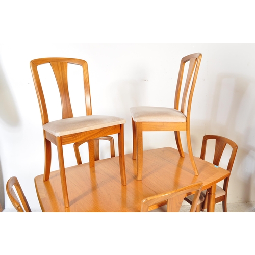 1270a - A vintage mid Century teak Meredew dining table and x6 chairs. The extending table of rectangular ov... 