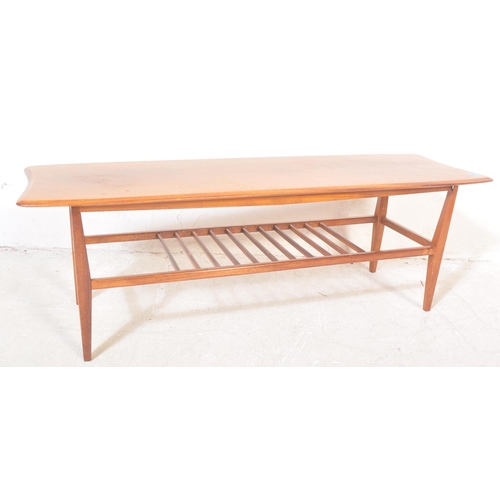 1272 - A vintage retro mid 20th century teak Ercol style coffee table. The coffee table having having a rec... 