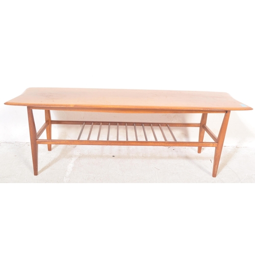 1272 - A vintage retro mid 20th century teak Ercol style coffee table. The coffee table having having a rec... 