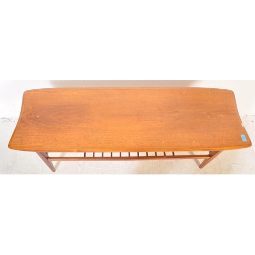 1272 - A vintage retro mid 20th century teak Ercol style coffee table. The coffee table having having a rec... 