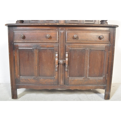 1276 - Ercol - A vintage retro 20th century Ercol beech and elm court cupboard sideboard having twin small ... 