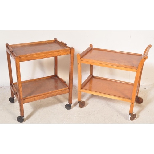 1279 - Two retro vintage 20th century oak drinks trolleys on castors. The lot to include a metamorphic oak ... 