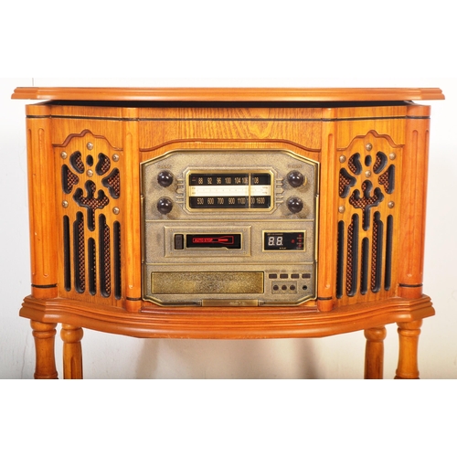 1284 - A vintage 20th century pine Canterbury cassette and CD player phonograph with radio /  stereogram wi... 