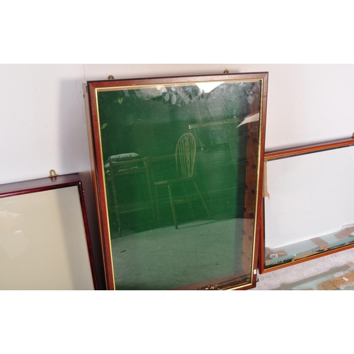 1286 - A collection of four vintage 20th Century wall mounted glazed front display cabinet. With teak body ... 