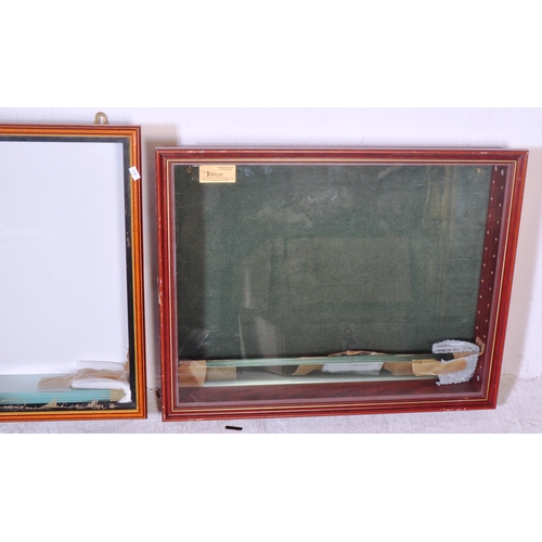 1286 - A collection of four vintage 20th Century wall mounted glazed front display cabinet. With teak body ... 