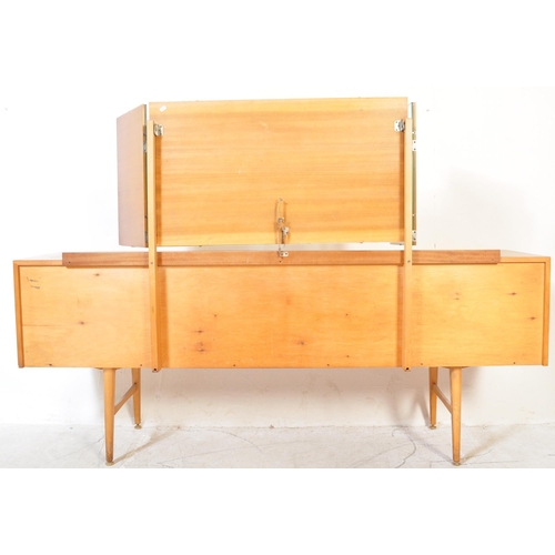 1287a - Mid century satin birch wood dressing table chest of drawers. Raised on tapering legs with a series ... 