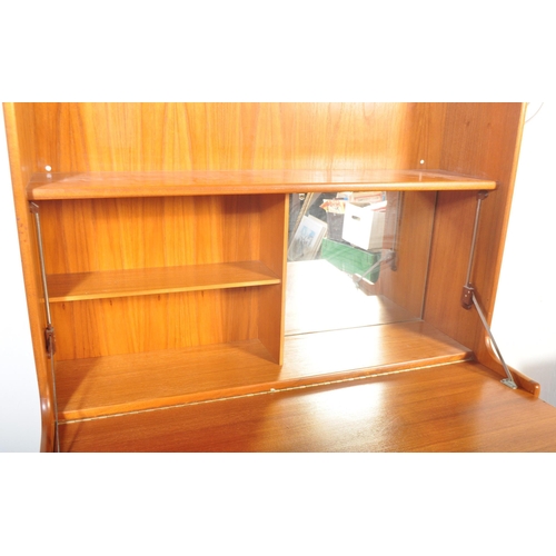 1293 - A vintage retro 20th century circa 1970s teak wood veneer wall unit / bookcase cabinet by Nathan in ... 