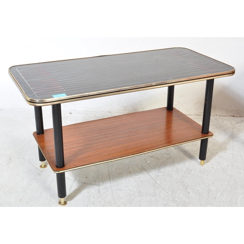 1297a - A collection of mid 20th Century teak wood coffee tables. One of them having a tile top in rectangul... 