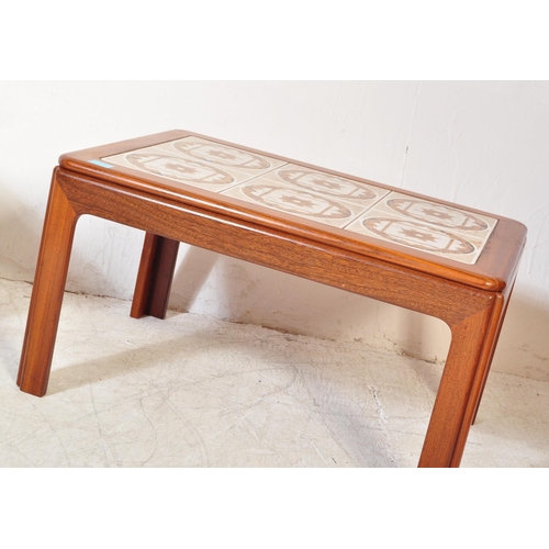 1297a - A collection of mid 20th Century teak wood coffee tables. One of them having a tile top in rectangul... 