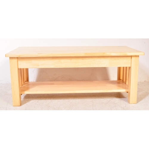 1300a - A contemporary modernist John Lewis light oak rectangular coffee table. The table with slatted side ... 