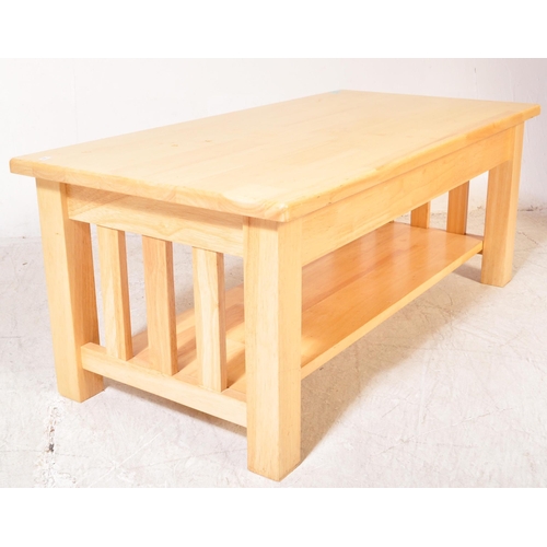 1300a - A contemporary modernist John Lewis light oak rectangular coffee table. The table with slatted side ... 