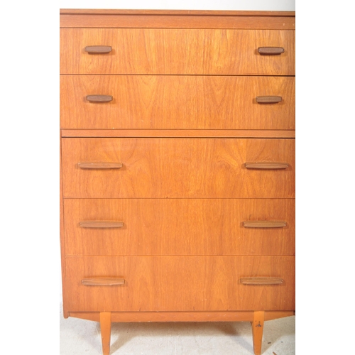 1302 - A retro mid 20th century teak chest of drawers having a bank of five drawers with stained wood recta... 