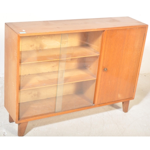 1303 - Lebus - A vintage retro mid 20th century teak glazed display cabinet bookcase having twin sliding gl... 