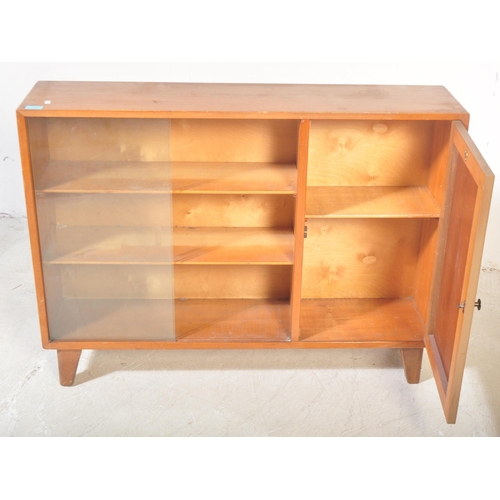 1303 - Lebus - A vintage retro mid 20th century teak glazed display cabinet bookcase having twin sliding gl... 