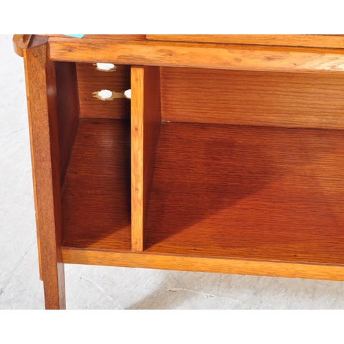 1317a - A retro 1950's mid 20th Century oak bookcase and clock combination. Of rectangular form with gallery... 