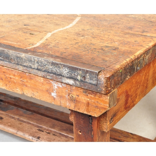 1324a - A large 20th century oak industrial style refectory dining table. The table having oak work top with... 