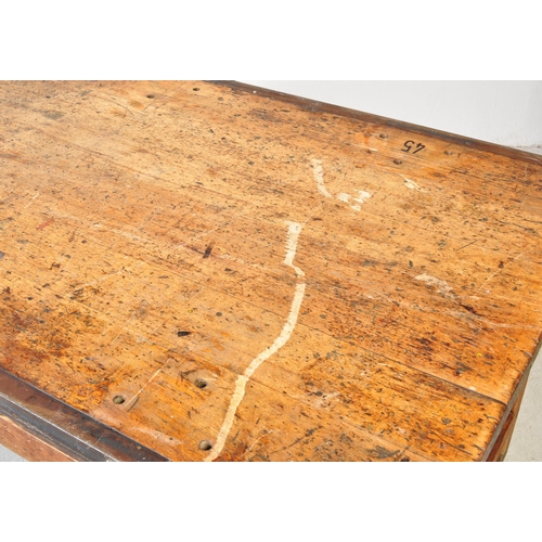 1324a - A large 20th century oak industrial style refectory dining table. The table having oak work top with... 