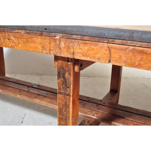 1324a - A large 20th century oak industrial style refectory dining table. The table having oak work top with... 