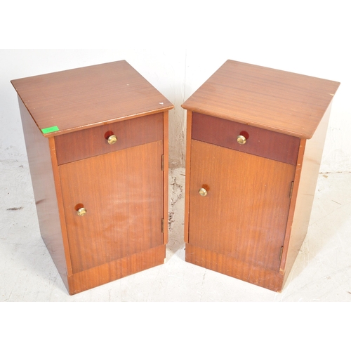 1330 - A pair of vintage mid 20th century walnut veneer bedside cabinets having a flared top over a single ... 