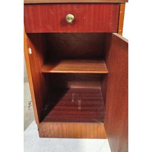 1330 - A pair of vintage mid 20th century walnut veneer bedside cabinets having a flared top over a single ... 