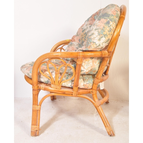 1333 - A retro vintage mid 20th Century circa 1970's bamboo and wicker cane armchair. Having a curved decor... 