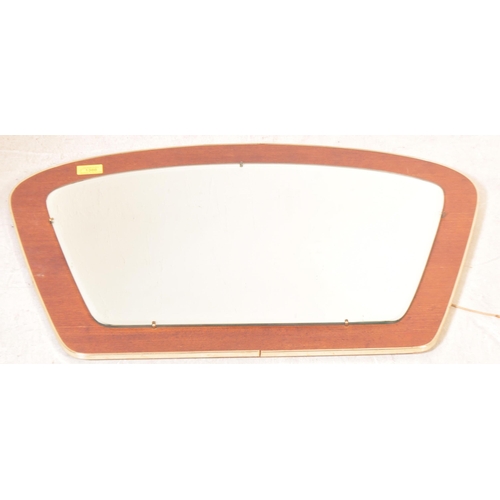 1336 - A retro vintage mid 20th Century circa 1970's stained teak wall mirror. With brass metal border, on ... 