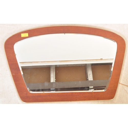 1336 - A retro vintage mid 20th Century circa 1970's stained teak wall mirror. With brass metal border, on ... 